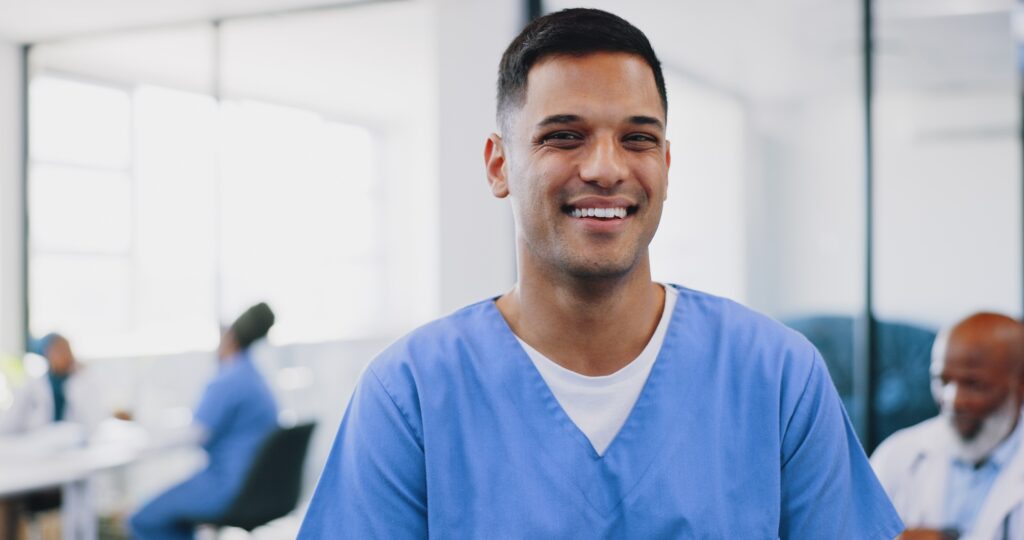 Face, man and happy nurse in hospital, smiling and ready for tasks. Portrait, medical professional