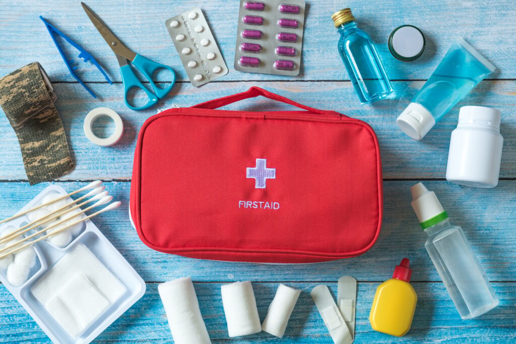 First aid kit with medical equipment and emergency objects at home or travel set