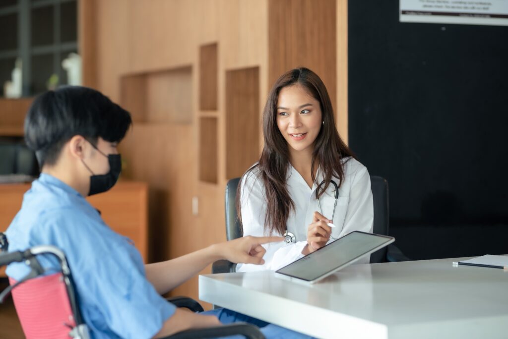 Healthcare professional consulting with a patient in a medical office.