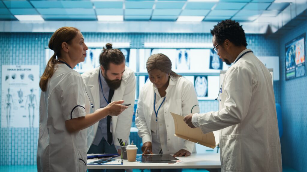 a group of Radiologists looking at x-rays.