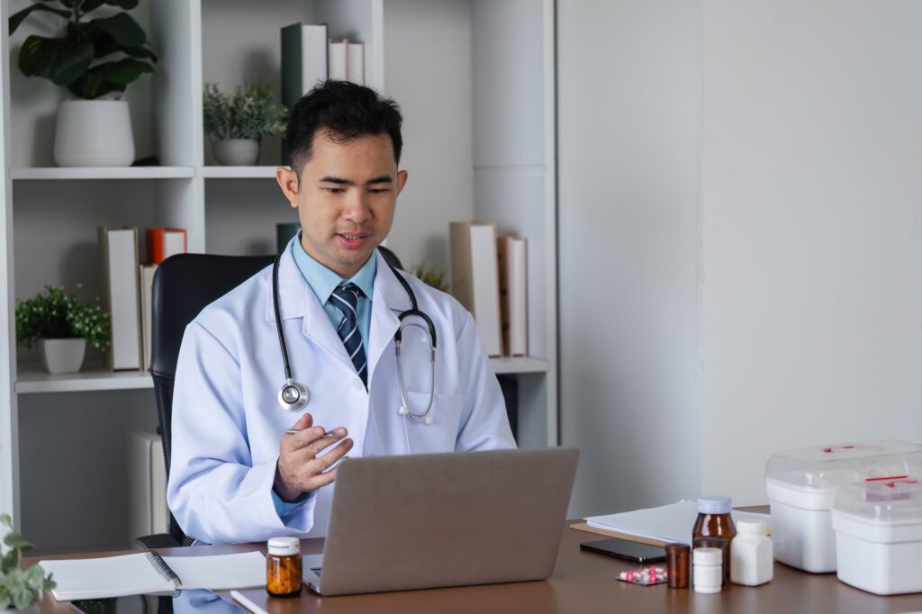 Male Doctor Engaged in Medical Studies for Advancing Health Care Practices in a Modern Clinical